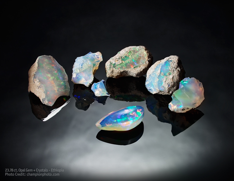 23.78 carat Wobito cut free-form Opal and rough crystals from Ethiopia
